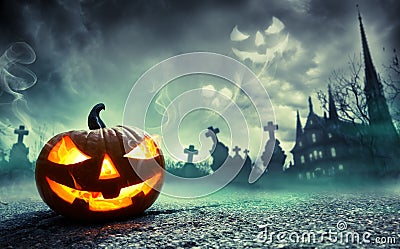 Pumpkin Burning In A Graveyard With Ghost Stock Photo