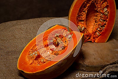 Pumpkin cut in half. Long pumpkin. Autumn vegetable. Stock Photo