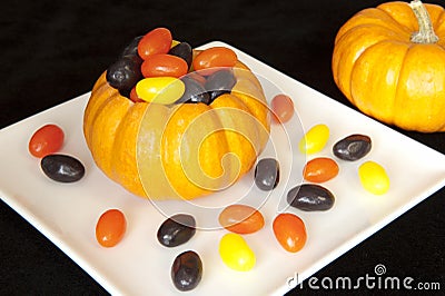 Pumpkin filled with Halloween Jellybeans Stock Photo