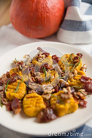 Pumpkin gnocchi with bacon Stock Photo