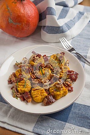 Pumpkin gnocchi with bacon Stock Photo