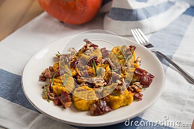 Pumpkin gnocchi with bacon Stock Photo