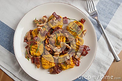 Pumpkin gnocchi with bacon Stock Photo