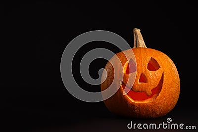 Pumpkin head on black background. Jack lantern - traditional Halloween decor Stock Photo