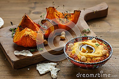 Pumpkin hummus and roasted butternut squash on background Stock Photo