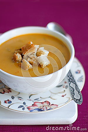 Pumpkin and lentils cream soup with croutons Stock Photo