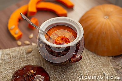 Pumpkin milk soup in a pot, close-up Stock Photo