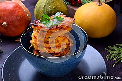 Pumpkin pancakes topped with parsley Stock Photo