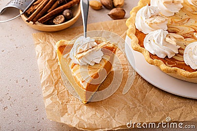 Pumpkin pie with cheesecake swirl, dessert variation for Thanksgiving Stock Photo