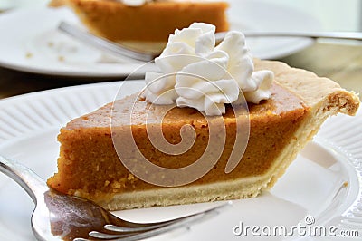 Pumpkin pie on a white plate Stock Photo