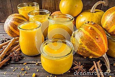 Pumpkin puree in different glass jars Stock Photo