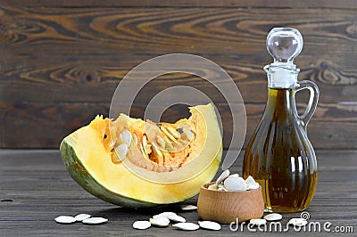 Pumpkin seed oil and pumpkin slice Stock Photo