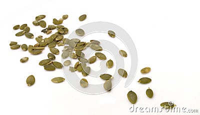 Pumpkin seeds scattered on white background Stock Photo