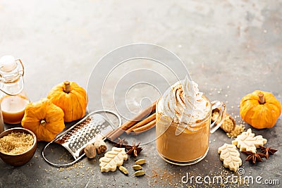 Pumpkin spice latte in a glass mug Stock Photo