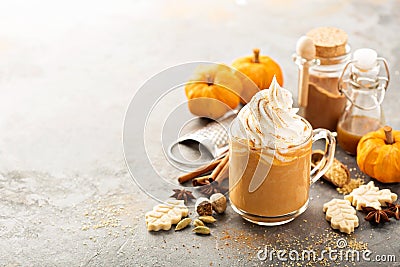 Pumpkin spice latte in a glass mug Stock Photo