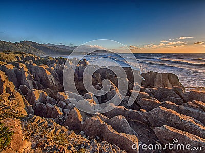 Punakaiki coastline at sunset, NZ Stock Photo