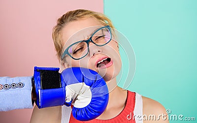 Punch in face. Destroy beauty. Cosmetology and plastic surgery services. Strong punch. Hand in boxing glove punching Stock Photo