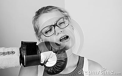 Punch in face. Destroy beauty. Cosmetology and plastic surgery services. Strong punch. Hand in boxing glove punching Stock Photo