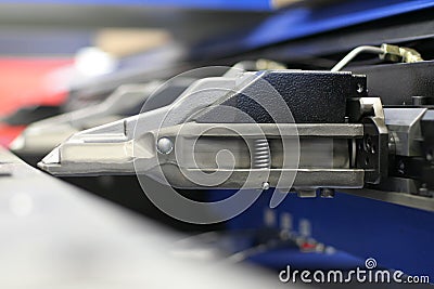 Punching machine gripper Stock Photo