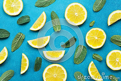 Punchy pastel background with lemon slices and mint leaves. Summer colorful pattern. Flat lay style. Stock Photo