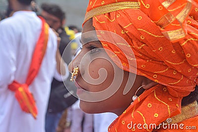 Closeup of a girl wearing a nath / nose ring with her traditional ethnic clothes. Ganpati Editorial Stock Photo