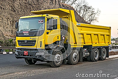 Pune, Maharashtra,India-March 14th, 2020: Brand new , fresh, yellow Tata Prima , model 3130K teeper truck under trial on highway Editorial Stock Photo