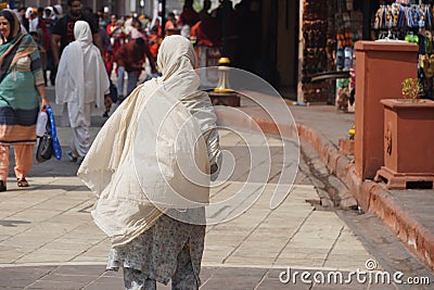 poor senior Indian lady backside image Editorial Stock Photo