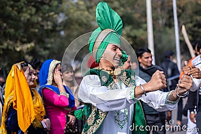 Punjabi male artist performing bhangra dance Editorial Stock Photo