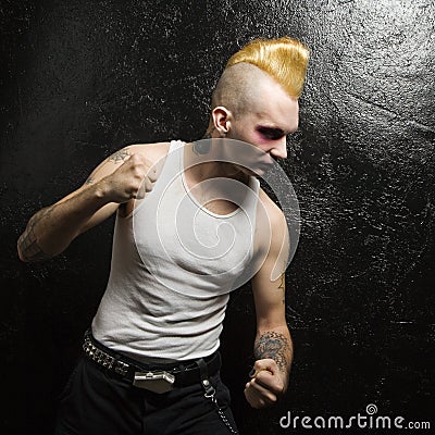 Punk with clenched fists. Stock Photo