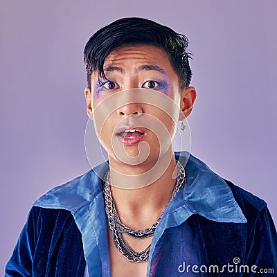 Punk, makeup and face in shock, wow and surprise with a gay man on a purple studio background for future or retro Stock Photo