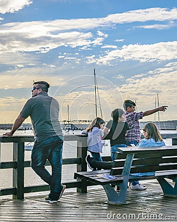 People at Punta del Este Waterfront Boardwalk Editorial Stock Photo