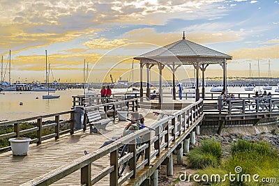 People at Punta del Este Waterfront Boardwalk Editorial Stock Photo