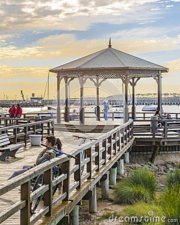 People at Punta del Este Waterfront Boardwalk Editorial Stock Photo