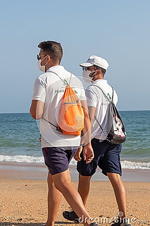 Punta Umbria, Huelva, Spain - August 7, 2020: Beach safety guard of Junta de Andalucia is controlling the social distancing and Editorial Stock Photo