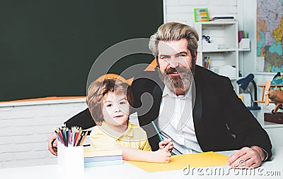 Pupil learning letters and numbers. After school teaching. Child tutoring. Child home studying and home education. Stock Photo