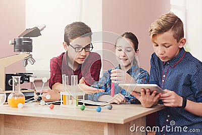 Pupils doing biochemistry research, stem education Stock Photo