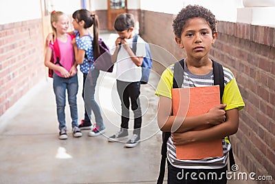 Pupils friends teasing a pupil alone Stock Photo