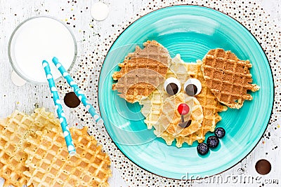 Puppy dog waffles for baby breakfast. Animal-shaped adorable art Stock Photo