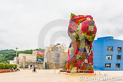 Puppy Floral Sculpture by Jeff Koons near entrance of Guggenheim Museum Bilbao Spain Editorial Stock Photo