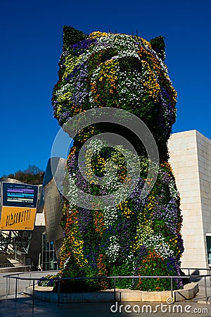 Puppy sculpture covered with flowers by the artist Jeff Koons Editorial Stock Photo