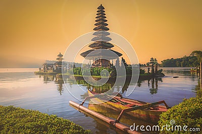 Pura Ulun Danu Bratan, Hindu temple with boat on Bratan lake landscape at sunrise in Bali, Indonesia Stock Photo