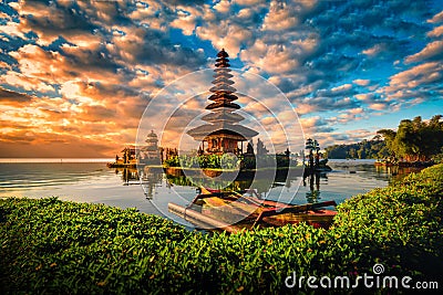 Pura Ulun Danu Bratan, Hindu temple with boat on Bratan lake landscape at sunrise in Bali, Indonesia Stock Photo