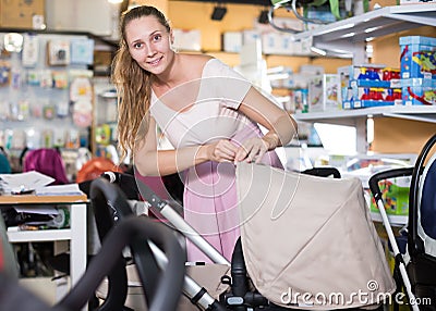 purchaser choosing pram for newborn Stock Photo