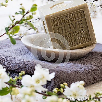 Pure green French olive oil solid soap in mineral cup Stock Photo