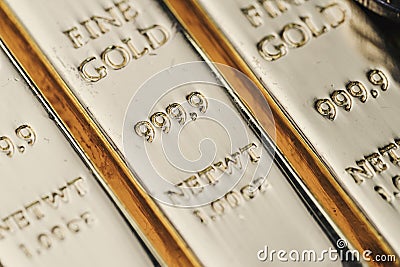 Pure 999.9 shiny fine gold bullions ingot bars, closed up macro Stock Photo