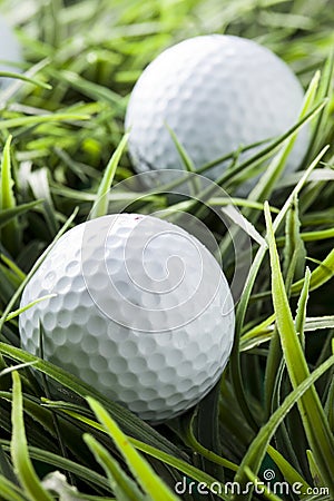 Pure White Golfball on green grass Stock Photo