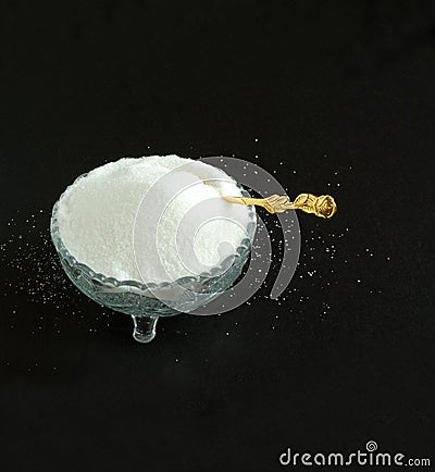 Pure White Granulated Sugar on a Black Background Stock Photo