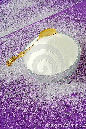Pure White Granulated Sugar on a Magenta Background Stock Photo