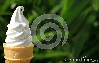 Pure White Vanilla Soft Serve Ice Cream Cone in Sunlight Stock Photo