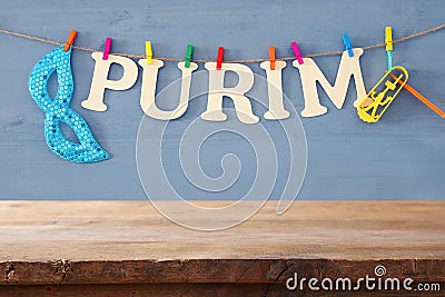 Purim celebration concept & x28;jewish carnival holiday& x29; in front of empty wooden table. product display backdrop. Stock Photo